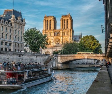 a-boat-on-a-river-with-buildings-on-either-side-of-it