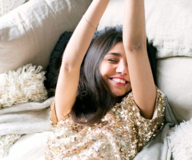 woman-wearing-brown-sequin-dress-laying-on-the-bed-thumb-image698864