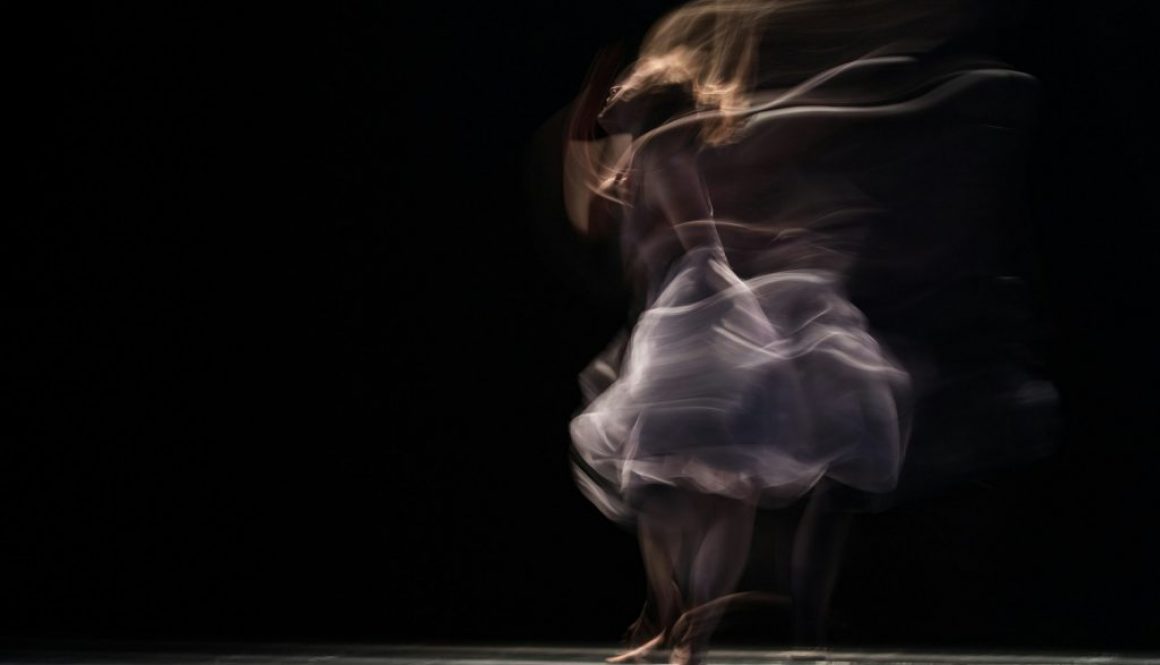 dancing-woman-on-concrete-pavement-JhqhGfX_Wd8