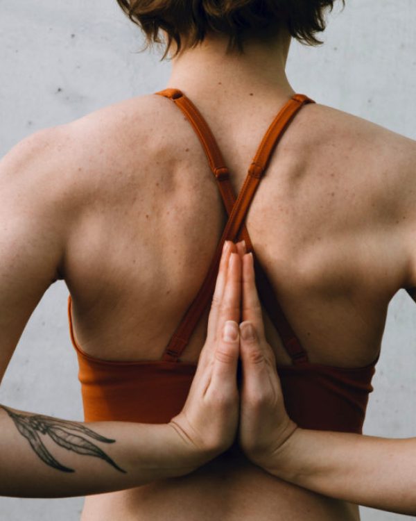 woman-crossing-arms-behind-back-jade-stephens-unsplash