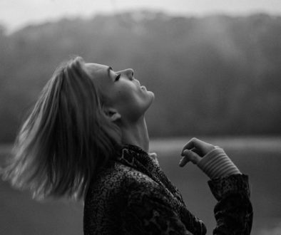 grayscale-photo-of-woman-in-black-and-white-floral-long-sleeve-shirt-Z7-S33TkIZ0