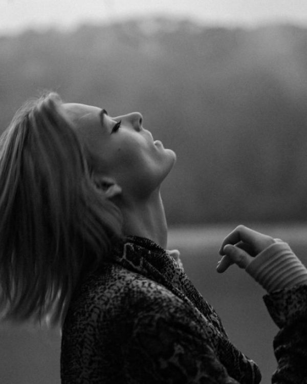 grayscale-photo-of-woman-in-black-and-white-floral-long-sleeve-shirt-Z7-S33TkIZ0